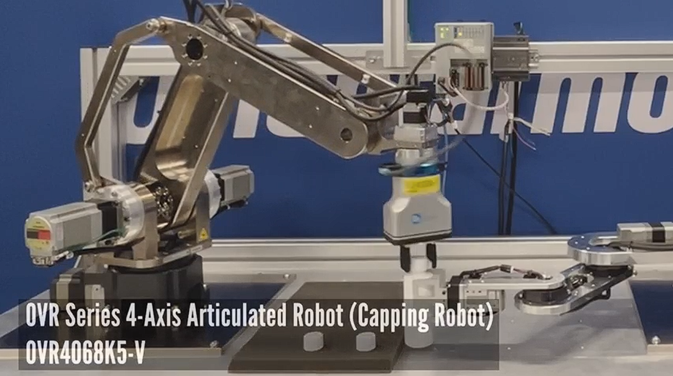 Coordinated Robots Bring Precision and Flexibility to Automated Bottle Capping